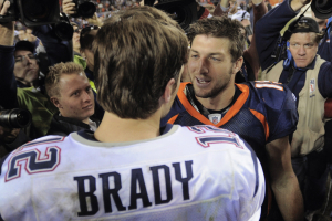 Tim Tebow (right) shakes hands with New England Patriots quarterback Tom Brady after the Patriots defeated the Broncos on Dec. 18, 2011. Now, they're due to be teammates. <br/>Mark Leffingwell /Reuters 