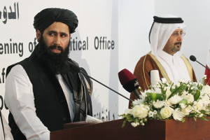 Muhammad Naeem (L), a spokesman for the Office of the Taliban of Afghanistan speaks during the opening of the Taliban Afghanistan Political Office in Doha June 18, 2013. The Afghan Taliban opened an office in Qatar on Tuesday to help restart talks on ending the 12-year-old war, saying it wanted a political solution that would bring about a just government and end foreign occupation. Taliban representative Mohammed Naeem told a news conference at the office in the capital Doha that the Islamist insurgency wanted good relations with Afghanistan's neighbouring countries. <br/>