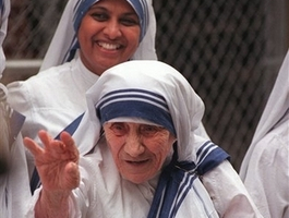 Mother Teresa waves to a crowd of onlookers in this June 18, 1997, file photo in the Bronx borough of New York. Mother Teresa's hidden faith struggle, laid bare in a new book that shows she felt alone and separated from God, is forcing a re-examination of one of the world's best known religious figures. <br/>(Photo: AP Images / Bebeto Matthews, file)