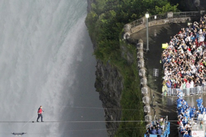 Tightrope walker Nik Wallenda walks the high wire from the U.S. side to the Canadian side over the Horseshoe Falls in Niagara Falls, Ontario, June 15, 2012. <br/>REUTERS/Mark Blinch