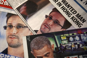Photos of Edward Snowden, a contractor at the National Security Agency (NSA), and U.S. President Barack Obama are printed on the front pages of local English and Chinese newspapers in Hong Kong in this illustration photo June 11, 2013. Snowden, who leaked details of top-secret U.S. surveillance programs, dropped out of sight in Hong Kong on Monday ahead of a likely push by the U.S. government to have him sent back to the United States to face charges. <br/>REUTERS/Bobby Yip 