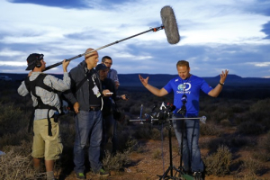 Daredevil Nik Wallenda gestures during a news conference after completing a high-wire walk on a two-inch (5-cm) diameter steel cable rigged 1,400 feet (426.7 metres) across more than a quarter-mile deep remote section of the Grand Canyon near Little Colorado River, Arizona June 23, 2013. <br/>REUTERS/Mike Blake
