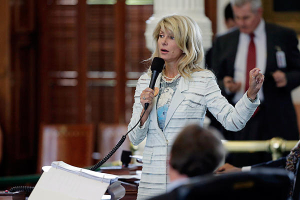 Texas state Sen. Wendy Davis (D) speaks as she begins a filibuster in an effort to kill an abortion bill, Tuesday, June 25, in Austin, Texas. The bill would ban abortion after 20 weeks of pregnancy and require abortion doctors to have visiting rights at nearby hospitals. <br/>Eric Gay/AP