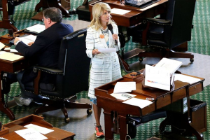 Sen. Wendy Davis, D-Fort Worth, stands on a near empty senate floor as she filibusters in an effort to kill an abortion bill, June 25, 2013, in Austin, Texas. <br/>(Eric Gay/AP)