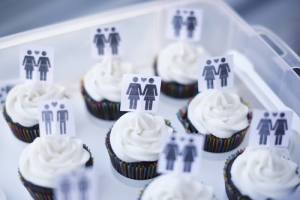 A box of cupcakes are seen topped with icons of same-sex couples at City Hall in San Francisco, June 29, 2013. Same-sex couples rushed to San Francisco's City Hall on Saturday to be legally married after the U.S. Ninth Circuit Court of Appeals officially ended California's ban on gay marriage following a landmark ruling at the Supreme Court this week. <br/>REUTERS/Stephen Lam