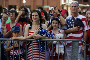 The Haig family stands for the United States pledge of allegiance before a public reading the United States Declaration of Independence, part of Fourth of July Independence Day celebrations, in Boston, Massachusetts July 4, 2013. <br/>REUTERS/Brian Snyder 