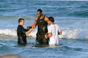 Dwight Howard is baptized Sunday in the Atlantic Ocean at Bethune Beach. He was one of a group of congregants from Orlando's Summit Church who took part in the ceremony. <br/>Urban Christian News