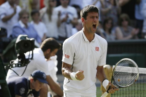Novak Djokovic of Serbia survives a five-set marathon to advance to the Wimbledon final. <br/>Anja Niedringhaus/AP 