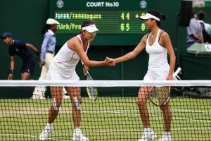 Peng Shuai (L) of China and Hsieh Su-Wei of Chinese Taipei celebrate during the third round of ladies's doubles against Tamarine Tanasugarn of Thailand and Darija Jurak of Croatia on day 7 of the Wimbledon Lawn Tennis Championships at the All England Lawn Tennis and Croquet Club in London, Britain on July 1, 2013. Peng Shuai and Hsieh Su-Wei won 2-0 to advance to the next round. <br/>(Xinhua/Tang Shi) 
