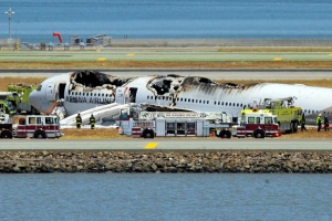 The Asiana Airlines Boeing 777 is seen on the runway at San Francisco International Airport after crash landing on July 6, 2013. <br/>