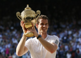 Andy Murray of Britain holds the winners trophy after defeating Novak Djokovic of Serbia (L) in their men's singles final tennis match at the Wimbledon Tennis Championships, in London July 7, 2013. <br/>REUTERS/Stefan Wermuth 