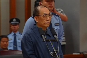 China's former railways minister, Liu Zhijun, attends a trial for charges of corruption and abuse of power at a courthouse in Beijing in this still image taken from video dated June 9, 2013. Liu was formally charged in April with abuse of power, taking bribes and malpractice. He took advantage of his position and helped 11 people to either get promotions or win contracts, accepting 64.6 million yuan ($10.53 million) in bribes from them in return between 1986 and 2011, the official Xinhua news agency reported. <br/> REUTERS/CCTV via Reuters TV