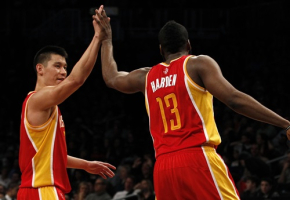 Houston Rockets point guard Jeremy Lin (L) and guard James Harden high five late in the fourth quarter against the Brooklyn Nets in their NBA basketball game in New York, February 22, 2013. <br/>REUTERS/Adam Hunger