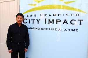 SF City Impact founder Roger Huang stands in front of their main building on 230 Jones St. (Gospel Herald) <br/>