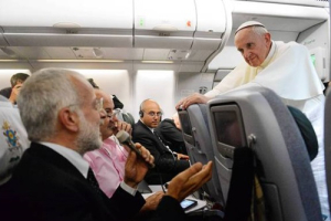 Pope Francis answers questions during a news conference aboard the papal flight to Rome from Brazil. <br/>Luca Zennaro, Associated Press / July 28, 2013