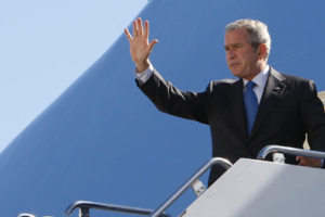 President Bush waves as he steps off Air Force One upon landing at John F. Kennedy International Airport in New York, Monday, Sept. 24, 2007, as he arrived for the United Nations General Assembly. <br/>(Photo: AP Images / Charles Dharapak)