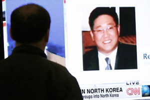 Kenneth Bae on a news bulletin in South Korea. North Korea says Bae could have faced death but the court reduced the penalty because he confessed <br/>Ahn Young-Joon/AP