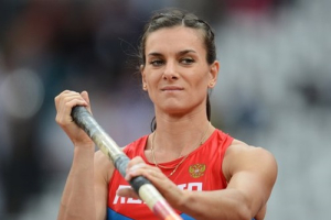 Russia’s Yelena Isinbayeva, the gold medalist in the women's pole vault, gestures during a news conference at the world track and field championships in Moscow on Thursday, Aug. 15, 2013. <br/>AP