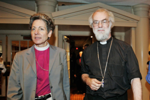 Presiding Bishop Katharine Jefferts Schori, left, and Archbishop of Canterbury Rowan Williams, walk into a press conference in New Orleans, Friday Sept. 21, 2007. <br/>(Photo: AP Images / Judi Bottoni)
