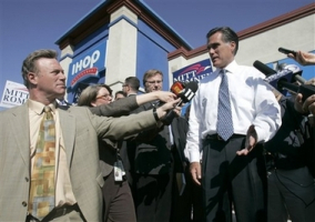 Presidential hopeful and former Massachusetts Gov. Mitt Romney, right, talks with reporters after a campaign stop at an IHOP in Sacramento, Calif., Thursday, Sept. 27, 2007. <br/>(Photo: AP Images / Rich Pedroncelli)