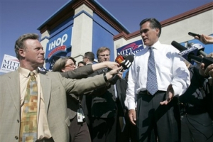 Presidential hopeful and former Massachusetts Gov. Mitt Romney, right, talks with reporters after a campaign stop at an IHOP in Sacramento, Calif., Thursday, Sept. 27, 2007. <br/>(Photo: AP Images / Rich Pedroncelli)