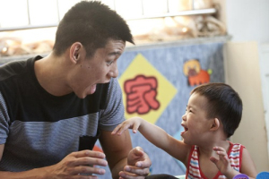 Jeremy Lin plays with a child with disability at an orphanage in China during his Asia trip on August 24, 2013. <br/>Prince of Peace Foundation