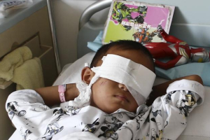Police in northern China launched a massive search Wednesday for a woman accused of gouging out the eyes of a 6-year-old boy. <br/>JON WOO/REUTERS