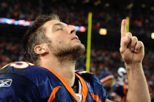 Tim Tebow gives glory to God after the game against the New York Jets on Nov. 17, 2011 in Denver. <br/>Garrett Ellwood/Getty Images