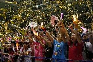 The Japanese celebrate after hearing that Tokyo had been chosen to host the 2020 Olympic Games during a public viewing event in Tokyo on Saturday. (Reuters) <br/>