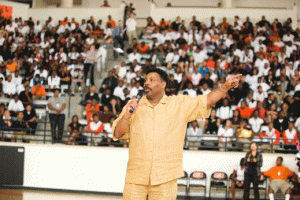 Dr. Tony Evans, founding pastor of Oak Cliff Bible Fellowship in Dallas, speaks to students during an assembly as part of the National Church Adopt-a-School Initiative. <br/>