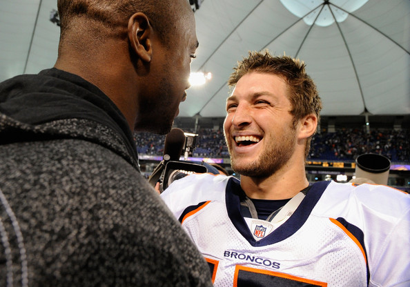 Adrian Peterson #28 of the Minnesota Vikings and Tim Tebow #15 of the Denver Broncos speak after their game on December 4, 2011 at Mall of America Field at the Hubert H. Humphrey Metrodome in Minneapolis, Minnesota. The Broncos defeated the Vikings 35-32. (Getty Images)