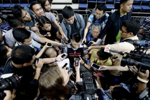 The Houston Rockets' Jeremy Lin is interviewed by a horde of reporters during a break in his team's practice at the Mall of Asia Arena at suburban Pasay city, south of Manila, Philippines, Tuesday Oct. 8, 2013. Lin has easily stolen the spotlight as the Houston Rockets practice for this week's first ever NBA preseason game against the Indiana Pacers in the basketball-obsessed Philippines. <br/> (AP Photo/Bullit Marquez)