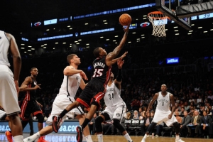NEW YORK, NY - OCTOBER 17: Mario Chalmers #15 of the Miami Heat shoots over Paul Pierce #34 of the Brooklyn Nets during the second quarter at Barclays Center on October 17, 2013 in the Brooklyn borough of New York City. Maddie Meyer / Getty Images <br/>