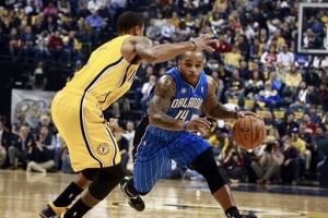 Orlando Magic guard Jameer Nelson, right, advances the basketball around Indiana Pacers guard George Hill in the first half of an NBA basketball game in Indianapolis, Tuesday, Oct. 29, 2013. <br/>R BRENT SMITH — AP Photo
