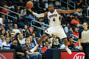 Oct 17, 2013; Atlanta, GA, USA; Atlanta Hawks power forward Paul Millsap (4) leaps to keep the ball in bounds in the first half against the San Antonio Spurs at Philips Arena. Mandatory Credit: Daniel Shirey-USA TODAY Sports <br/>