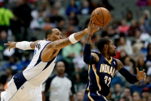Dallas Mavericks forward Shawn Marion, left, attempts to steal the ball away from Indiana Pacers' C.J. Watson (32) in the first half of a preseason NBA basketball game, Friday, Oct. 25, 2013, in Dallas. Photo: Tony Gutierrez, AP <br/>