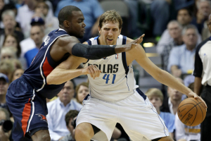 1/2) Dallas Mavericks' Dirk Nowitzki (41), of Germany, fights off Atlanta Hawks' Paul Millsap as he looks for a shot opportunity in the first half of an NBA basketball game Wednesday, Oct. 30, 2013, in Dallas. (AP Photo) <br/>