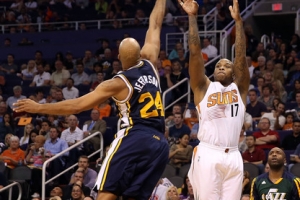 P.J. Tucker #17 of the Phoenix Suns puts up a shot over Richard Jefferson #24 of the Utah Jazz during the first half of the NBA game at US Airways Center on November 1, 2013 in Phoenix, Arizona. <br/>