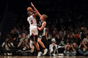 Miami Heat shooting guard Dwyane Wade (3) is fouled by Brooklyn Nets small forward Andrei Kirilenko. <br/>Brad Penner-USA TODAY Sports
