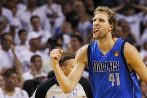 Dallas Mavericks' Dirk Nowitzki celebrates against the Miami Heat during the fourth quarter in Game 6 of the NBA Finals basketball series in Miami, June 12, 2011. <br/>Reuters