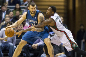 Larry Sanders of the Bucks has a tough time trying to contain Timberwolves big man Nikola Pekovic, who finished with 27 points. <br/>Reuters