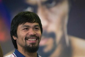 Manny Pacquiao of the Philippines smiles during a news conference in New York August 6, 2013.   <br/>REUTERS/Shannon Stapleton