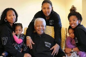 Nelson Mandela, center, with his three daughters and grandchildren. <br/>
