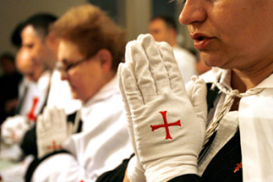 Members of the Teutonic Knghts order pray at the Lutheran church in Bucharest Romania Saturday Jan. 19 2008. Christian churches in Romania celebrate the Week of Prayer for Christian Unity which is in its 100th year of existence and involves joint prayers for unity of the Christians. <br/>(AP Photos/Vadim Ghirda)