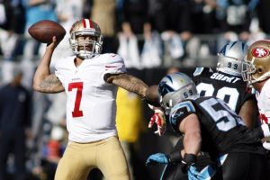 Jan 12, 2014; Charlotte, NC, USA; San Francisco 49ers quarterback Colin Kaepernick (7) throws against the Carolina Panthers during the first quarter of the 2013 NFC divisional playoff football game at Bank of America Stadium. Mandatory Credit: Jeremy Brevard-USA TODAY Sports <br/>