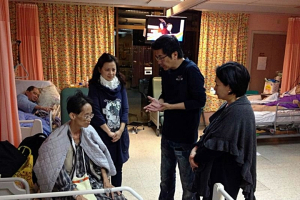 William Yu and his wife visit patients in hospitals and share their testimony of healing. (Photo: Courtesy of William Yu) <br/>