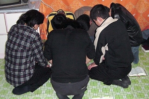 North Korean Christians during a prayer meeting. <br/>(Open Door)