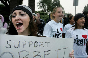 Former student of Dr. James Corbett Gianna DeCaro, 20, participates in a rally outside of Capistrano Valley High School in Mission Viejo in December. <br/>(Photo: The Orange County Register / Christina House)