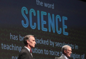 Creation Museum head Ken Ham, right, speaks during a debate on evolution with TV's 