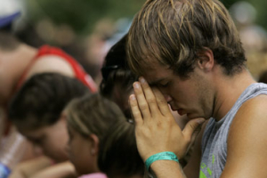 A boy prays during an altar call at the Creation Christian music festival in Shirleysburg, Pa., Thursday, June 28, 2007. <br/>(Photo: AP Images / Carolyn Kaster)